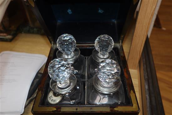 A Victorian coromandel four bottle decanter box